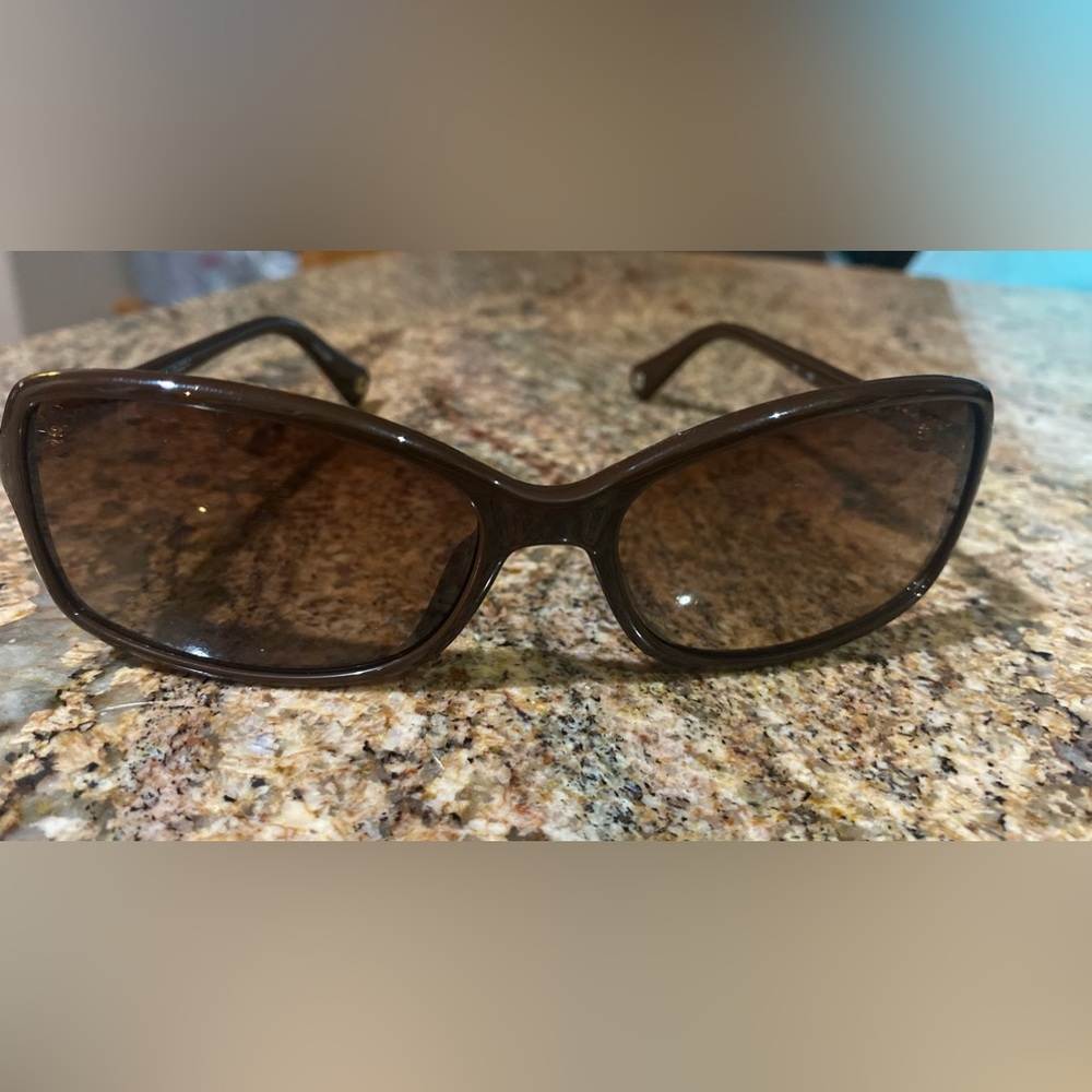 Coach sunglasses with hard covered case.